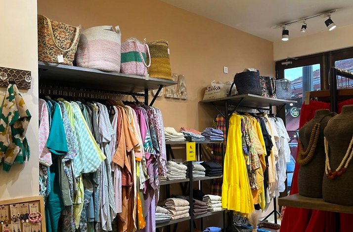 Racks and shelves with clothes and accessories in one of the clothing stores in Panjim, India.