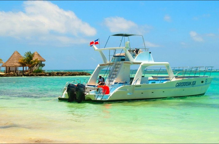 Catamaran with the flag of Dominican Republic in the Punta Cana lagoon