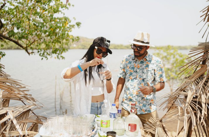 A group of persons at Sai Island mixing a cocktail