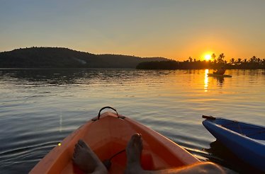 A person in a kayak at river Chaporá, close to private Sai Island