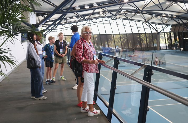 A couple of spectators roaming around the National Tennis Centre in Melbourne Park.