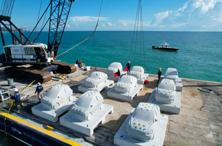 Concrete cars used in arsist Leandro Erlich's Concrete Coral, an underwater car installation.