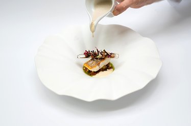 A haute cuisine dish served in  the Michelin-starred restaurant Au Coin des Bons Enfants