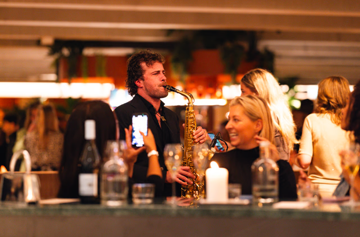 A saxophonist performing for guests at Hotel V in Amsterdam.