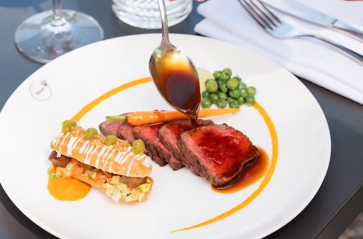 Steak meal served at Hotel Flora Batava restaurant.