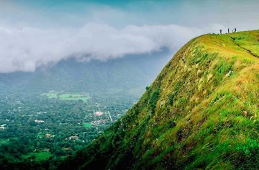 Travelers on the crater of an extinct volcano on a private tour of Anton Valley.