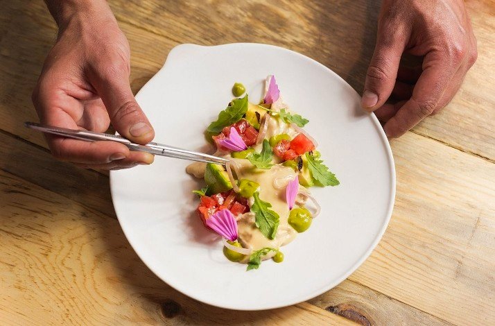 A shot from above of the dish displayed on the white plate made at the Marmiton Bistro, Madrid.