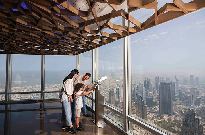 Parents and son enjoy the views from At the Top, Burj Khalifa.