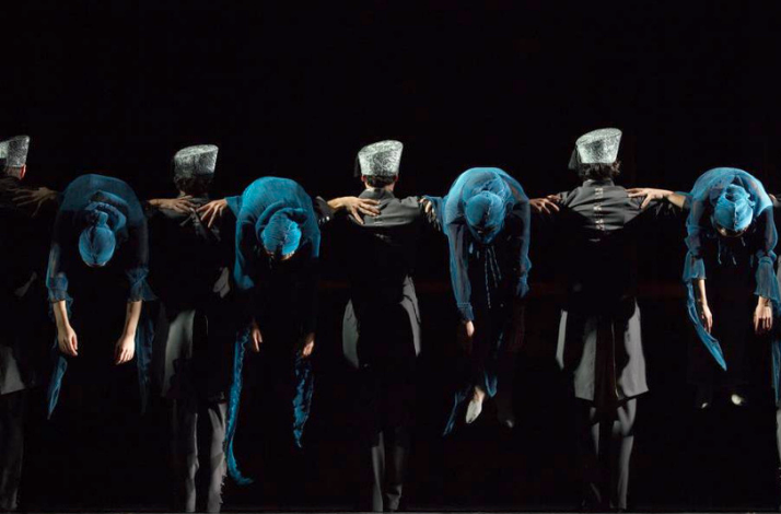 Ballet dancers performing together on stage.
