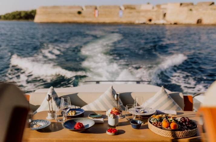 A served table on the yacht with the view on the water.