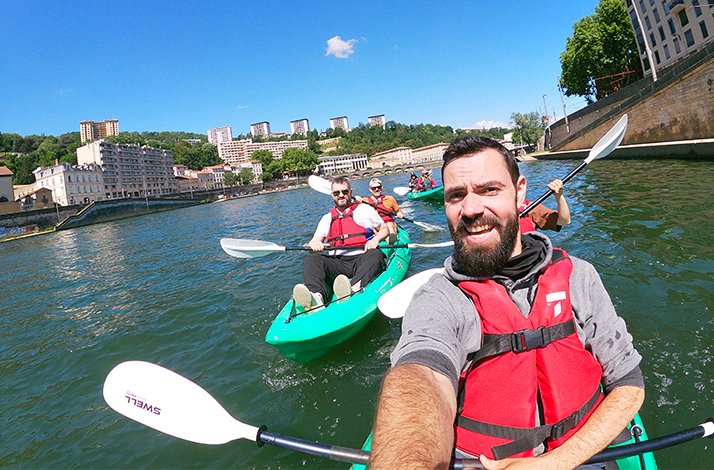 A group of tourists partiticipating in  immersive guided kayaking tour of Lyon with exclusive extras.