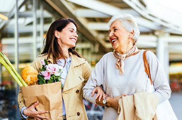 Two women looking and smiling at each other