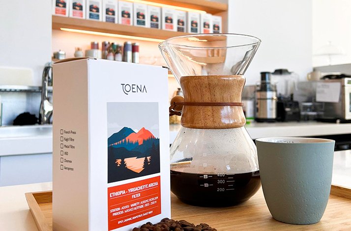 A Ethiopian filter, coffee and a cup on the table.