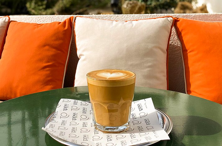 A cup of coffee on the table outside.