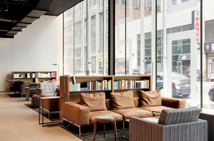 Shroud yourself in gothic mystery at Viola's Room at The Shed: In New York, New York A chair and table set with food near a wide window.