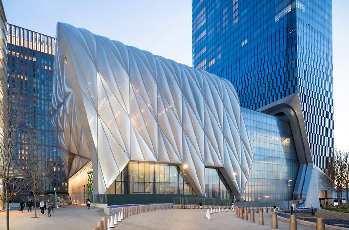 An architectural photo of The Shed in New York, showing its distinctive, quilted metallic movable shell.