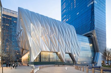 An architectural photo of The Shed in New York, showing its distinctive, quilted metallic movable shell.