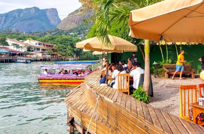 People enjoy a meal at Laguna, a waterfront restaurant featuring a select menu of popular dishes.
