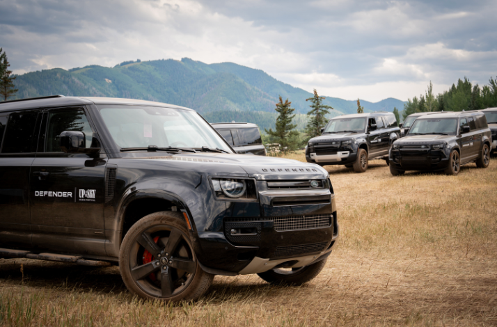 Several luxury Defender transports lined up for the Up in the Sky Festival guest.