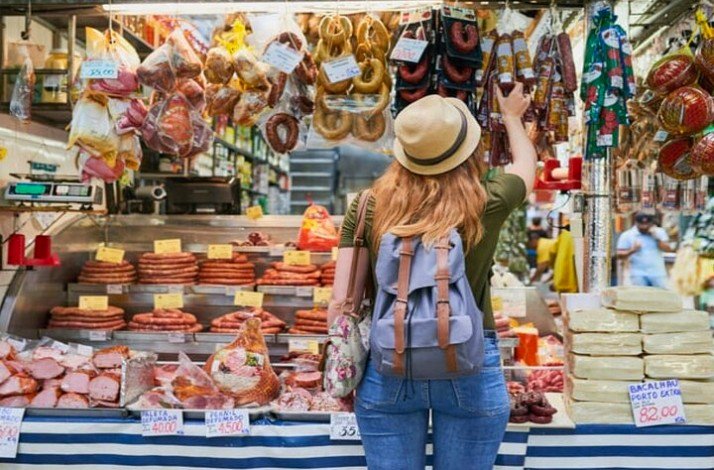 A tourist choosing colorful souvenirs in Sao Paolo, Brazil 