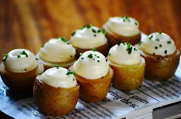 Roasted potatoes with cream cheese in Barcelona's Gràcia district.