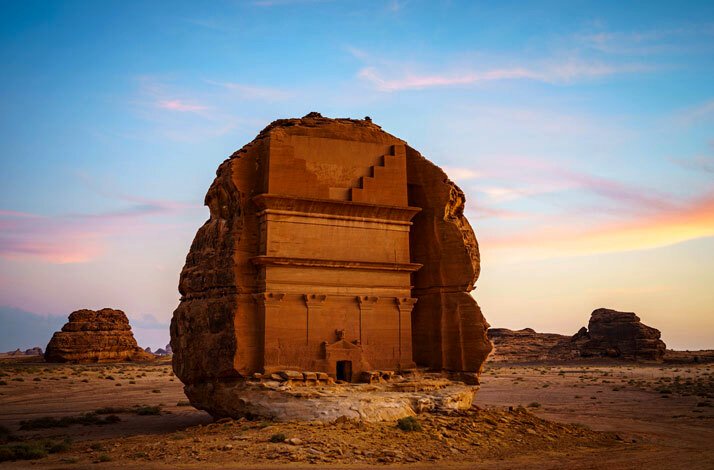 The ancient city of Petra in Saudi Arabia, featuring its iconic rock formations and intricate carvings in the sandstone.
