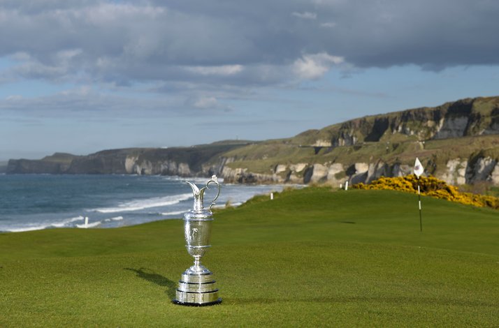 The golf cup standing on the golf field next to coast