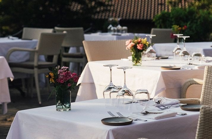Table settings with flowers and upturned glasses at Casa Lavanda.