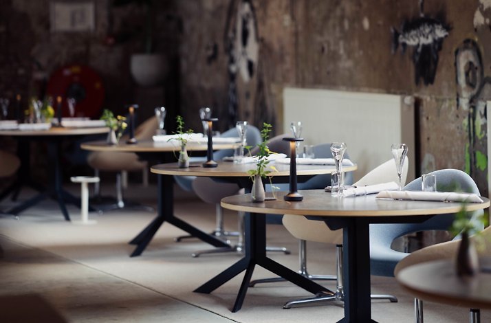 Interior with served tables in restaurant ONE.