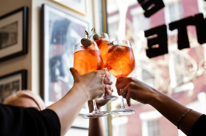 People having a toast with bespoke cocktails at Caffe Dante