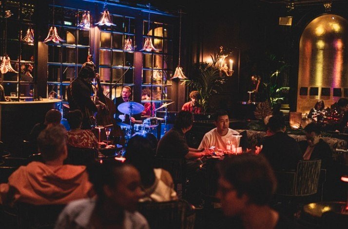  Interior of The Savoy in the evening with the band playing on the scene