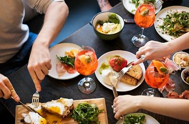 People enjoying a diverse meals and bespoke cocktails at Caffe Dante