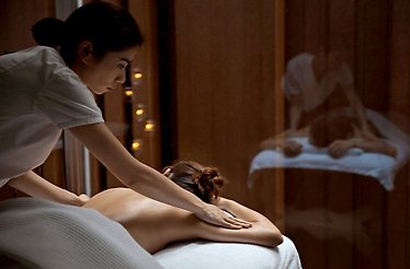 Girl enjoys Thai Massage in Como Shambhala Metropolitan Bangkok.