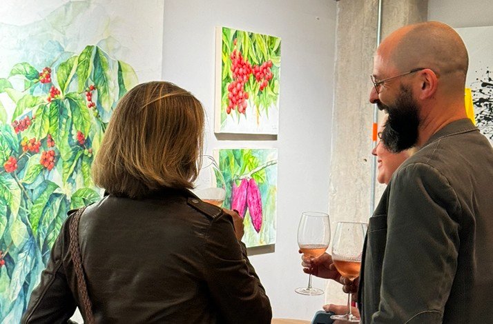 People discuss pictures of various plants at Zehn Living.