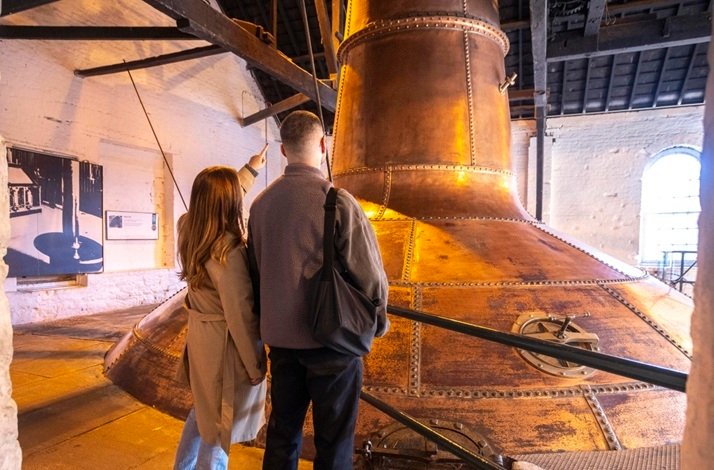 Two visitors inside the Midleton Distillery.