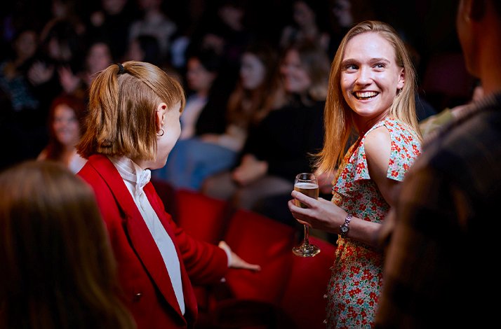 Red Coat concierge and a guest at LW Theatre.