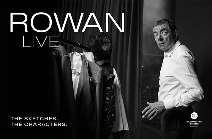 Rowan Atkinson posed backstage beside costumes, promoting Rowan Live — 'The Sketches. The Characters.' — at Gillian Lynne Theatre.