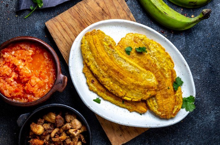 Toston fried and flattened whole green plantain banana