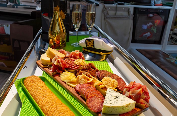 Glasses of champagne and an upscale brunch service with mimosas and pastries served.