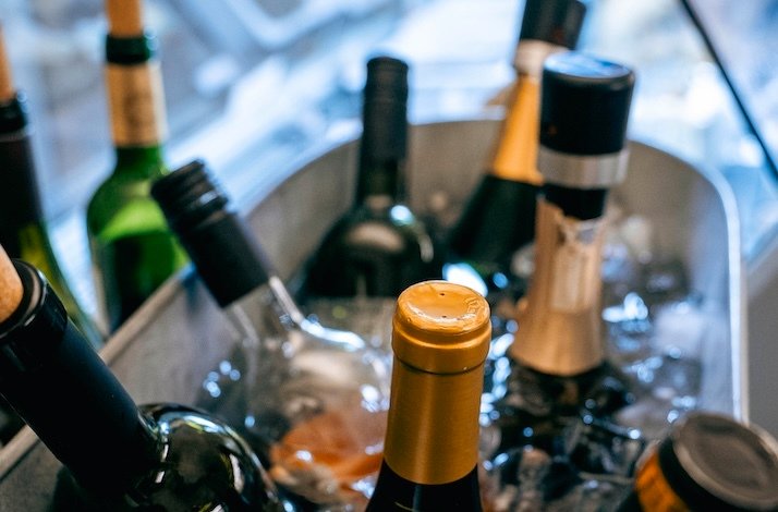 Wine bottles in an ice bucket at The Winery.