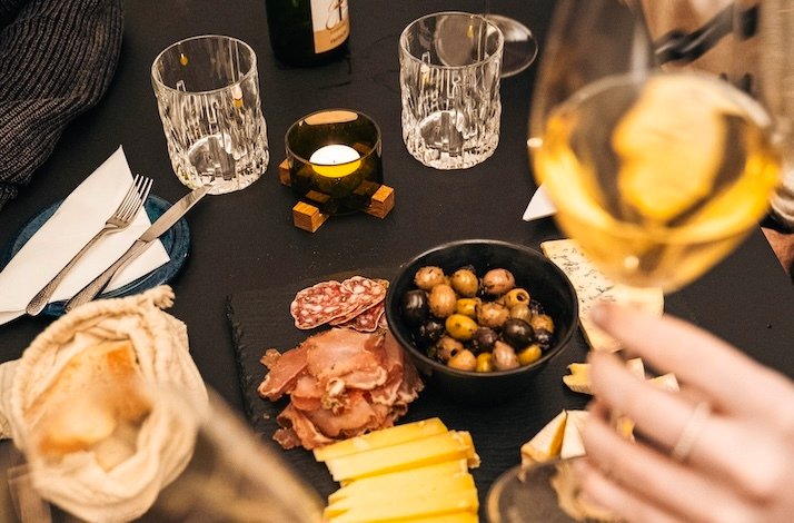 A table set with appetizers and wine at The Winery.