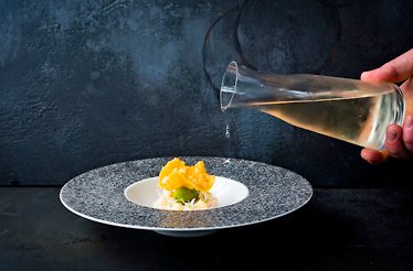 One of the dishes is drizzled with oil at the Michelin-starred Old Stamp House in Ambleside.