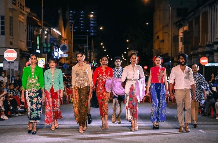Models wearing Kenny Loh Couture on the street.