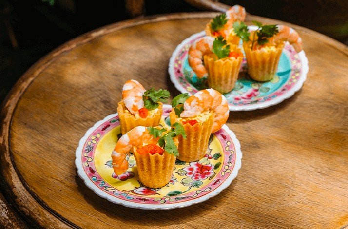 Tartlets with shrimps made by Sophia Yeow, a former contestant on MasterChef Singapore on white plates.