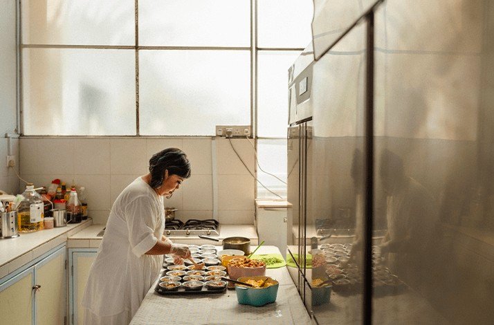 Sophia Yeow, a former contestant on MasterChef Singapore cooking an award-winning private dinner recognised by Vogue Singapore, Tatler Dining.