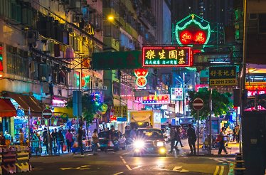 Beautiful neon signs on streets of Hong Kong at night.