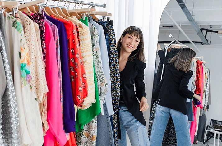 Sera Murphy browses through a collection of clothes at The Reoutfitter