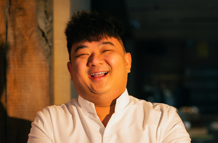 Close up photo of Chef Lee Zhe Xi, in white chef garment