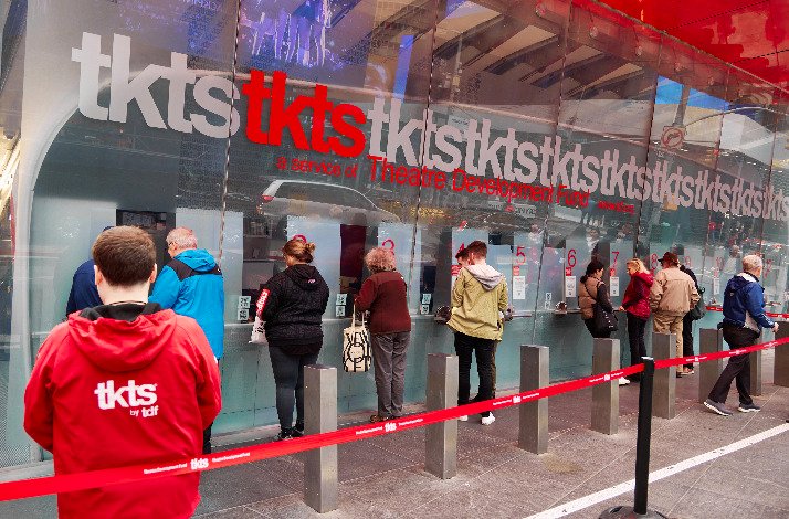 A crowd of people queue at TKTS Times Square.