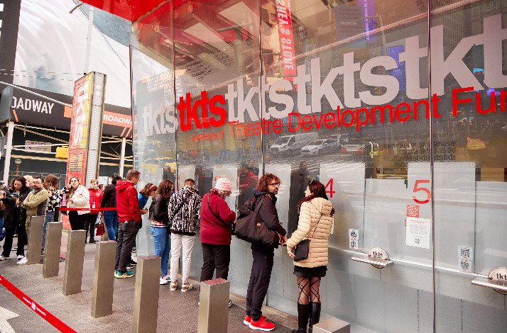 A crowd of people queue at TKTS Times Square.